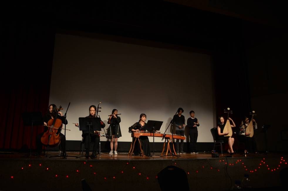 Ensemble performing a staged cross-cultural concert